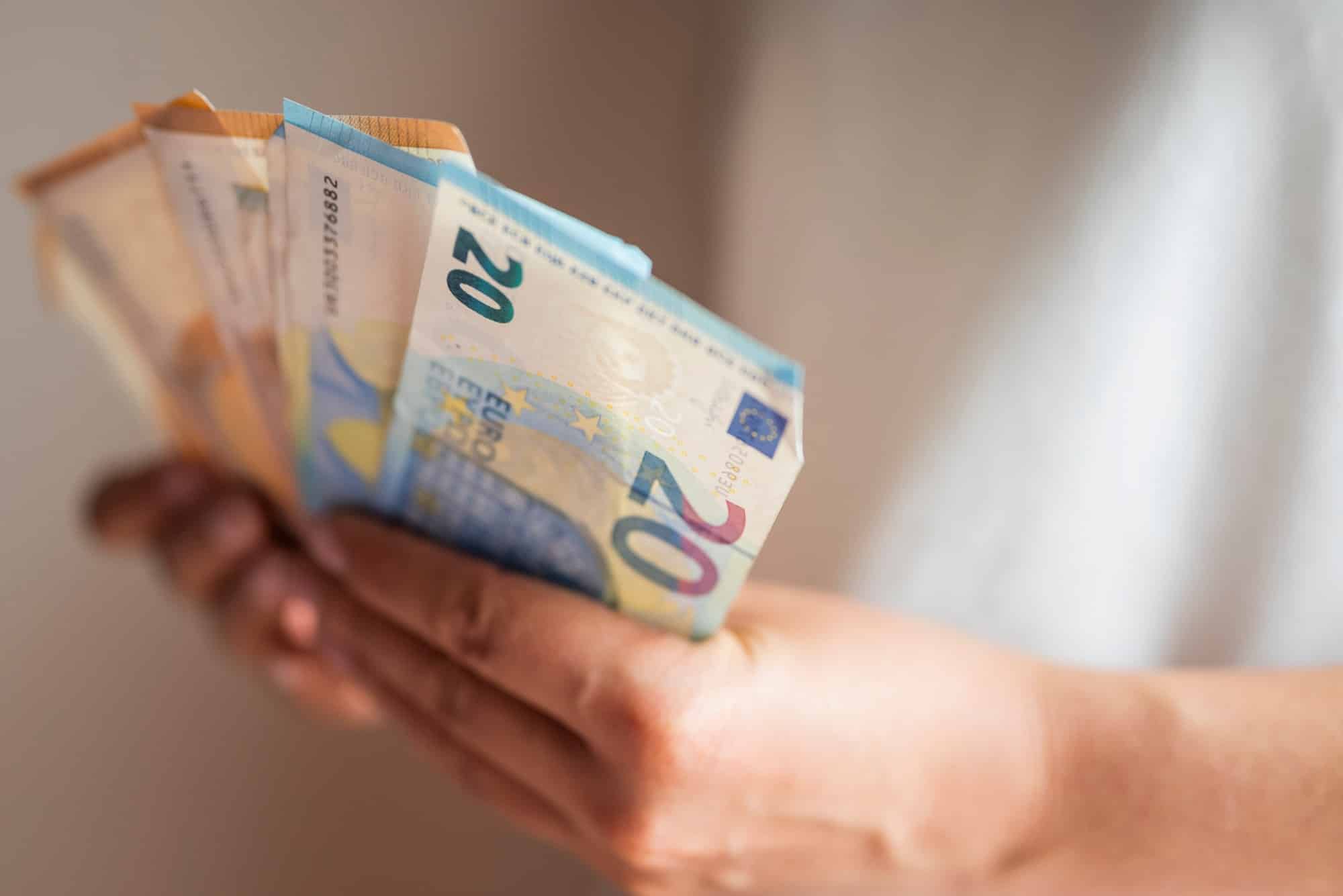 euro money banknotes in the hands of a girl